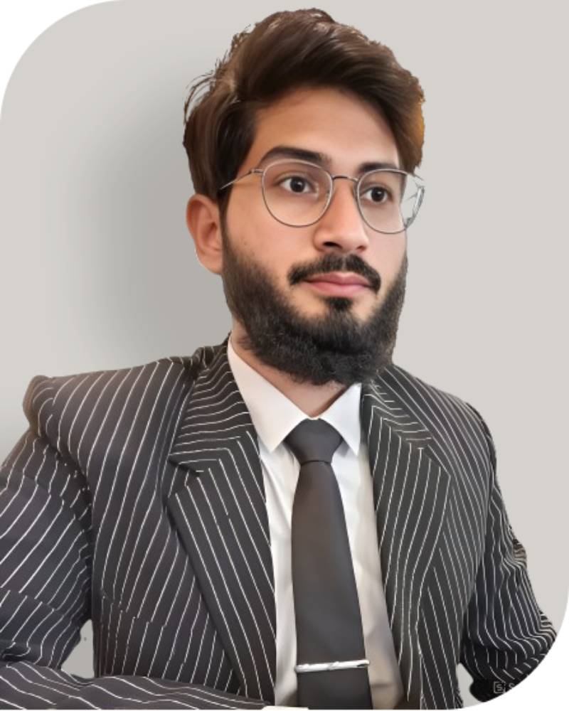 Professional man in a pinstripe suit and glasses looking confident and composed